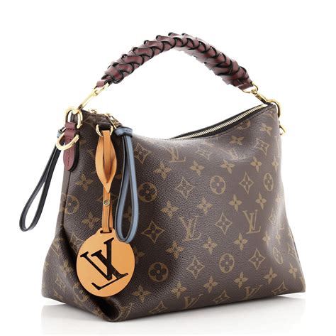 lv bag with braided handle.